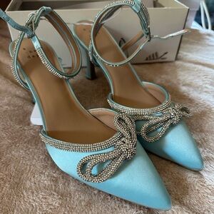 Blue heels with rhinestone bow